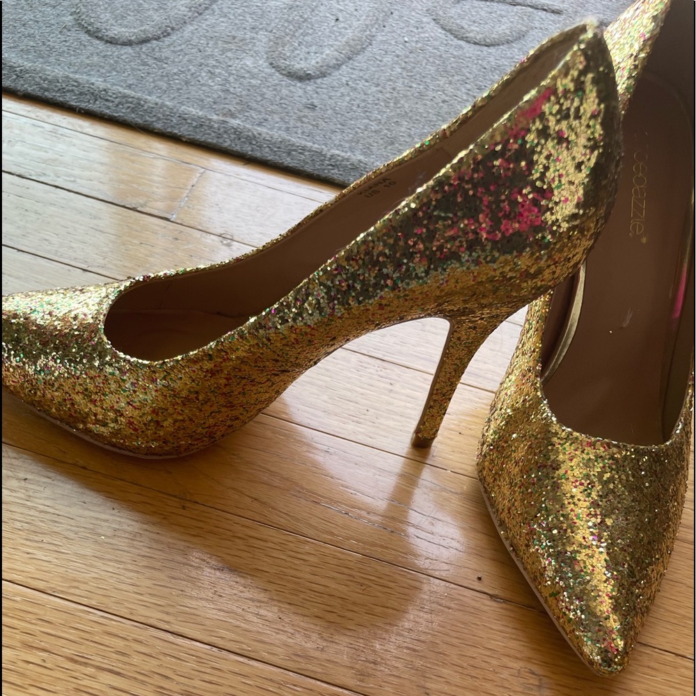 Gold pointed toe stilettos